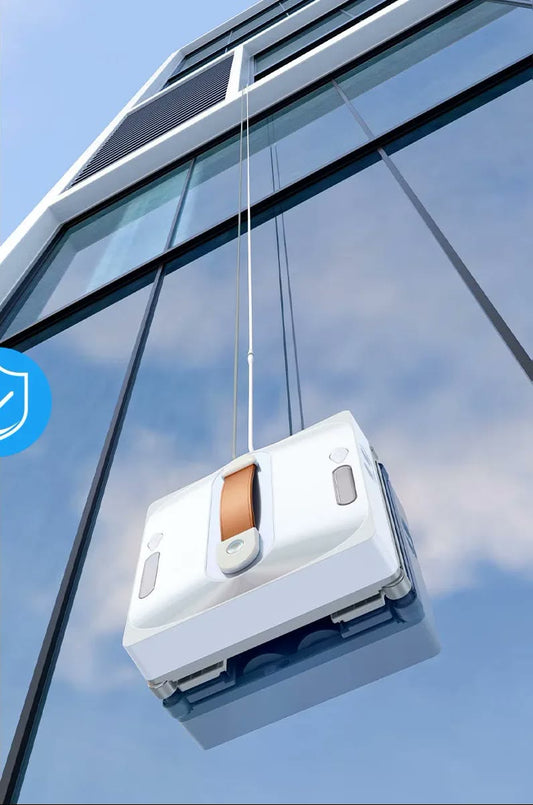 CleanBot R1 robot window cleaner secured by its safety rope cleaning tall glass high on a building — no ladder needed